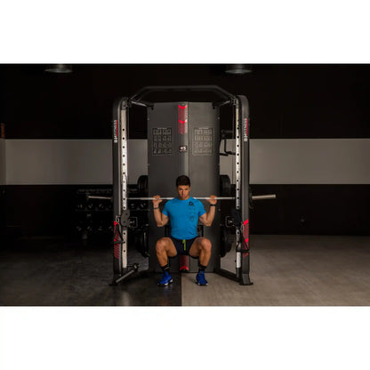 Person using a weightlifting machine in a gym setting