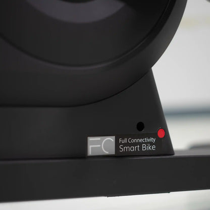 Close-up of bottom support of a black bike component with 'Full Connectivity Smart Bike' label.