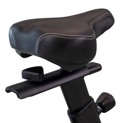 Exercise bike seat with adjustable lever on a white background