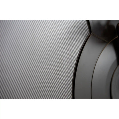 Close-up of a carbon fiber texture with a blurred object in the foreground