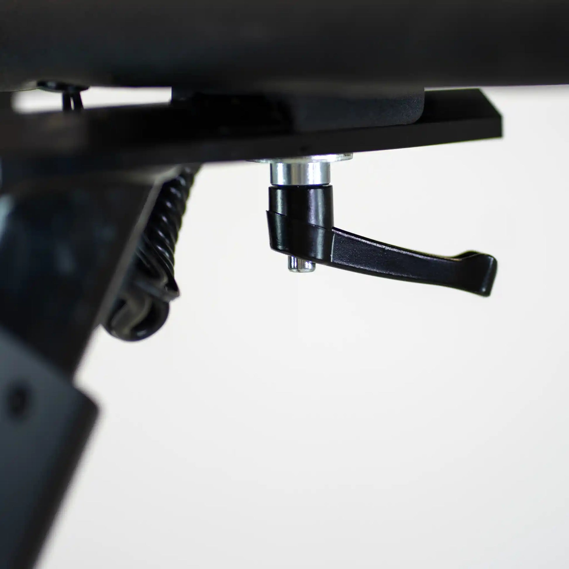 Close-up of a black adjustable handle bar lever with a white background
