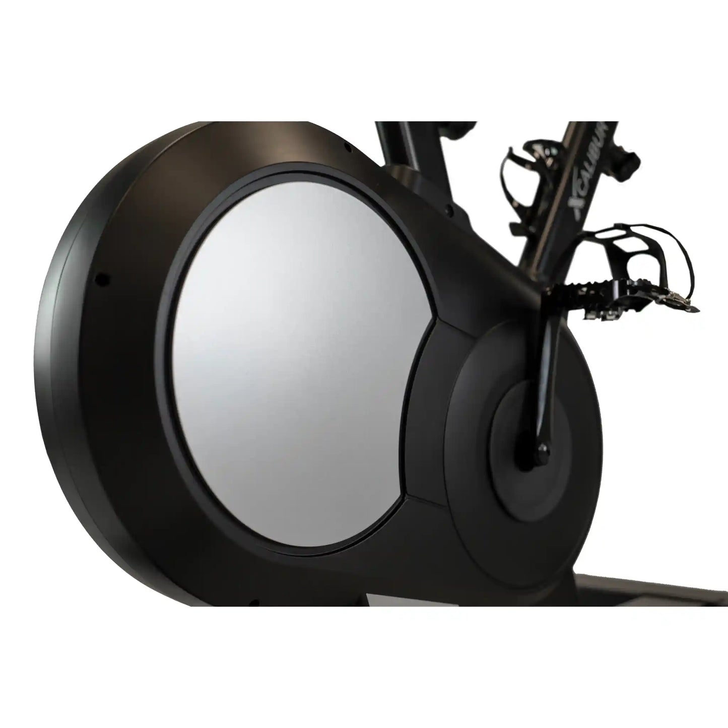 Close-up of a black exercise bike wheel with a white background