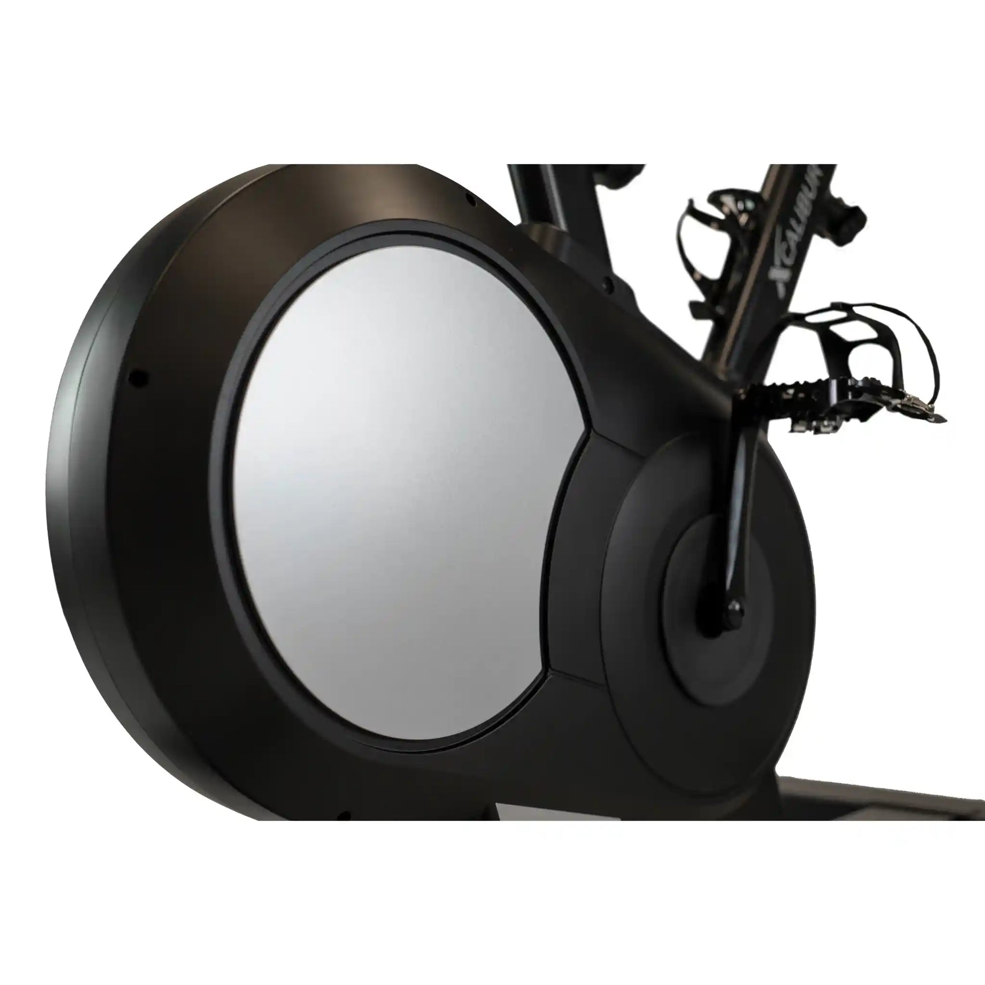 Close-up of a black exercise bike wheel with a white background