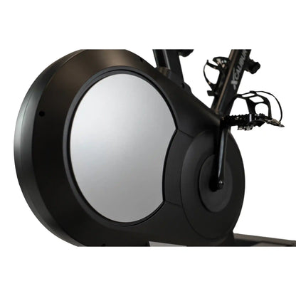 Close-up of a black exercise bike wheel with a white background