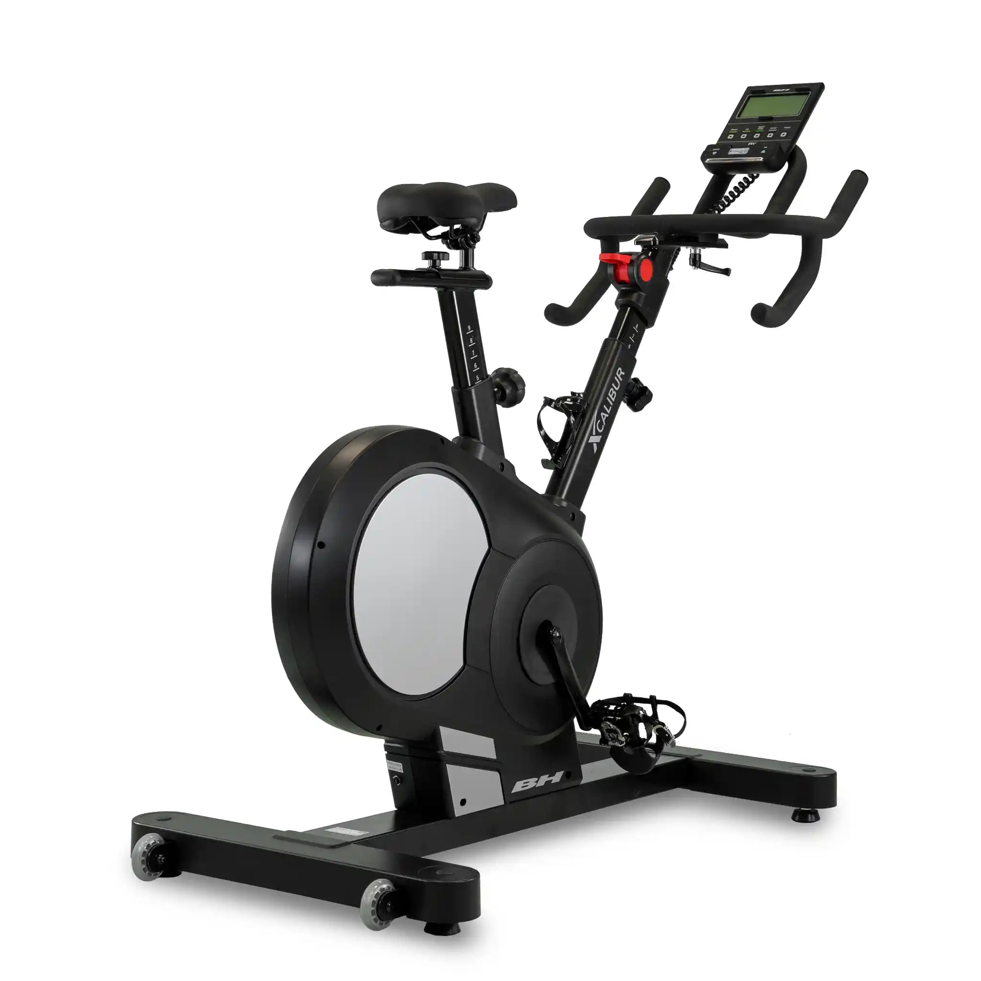 Black exercise bike with digital display on a white background