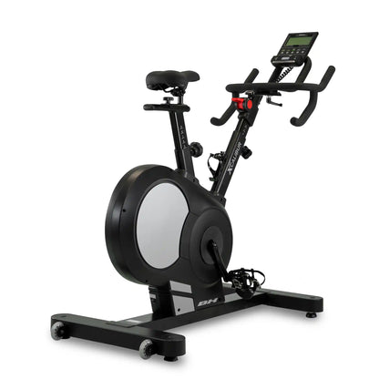 Black exercise bike with digital display on a white background