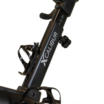 Black exercise bike with visible branding on a white background