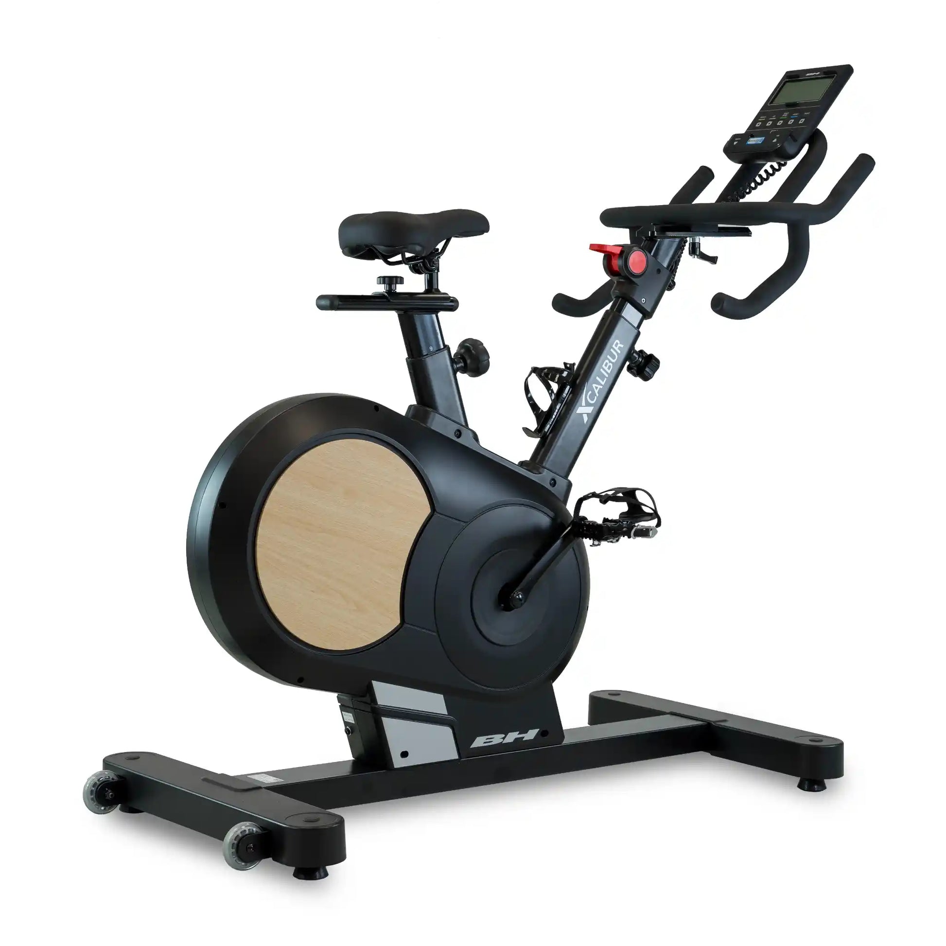 Black exercise bike with digital display on a white background