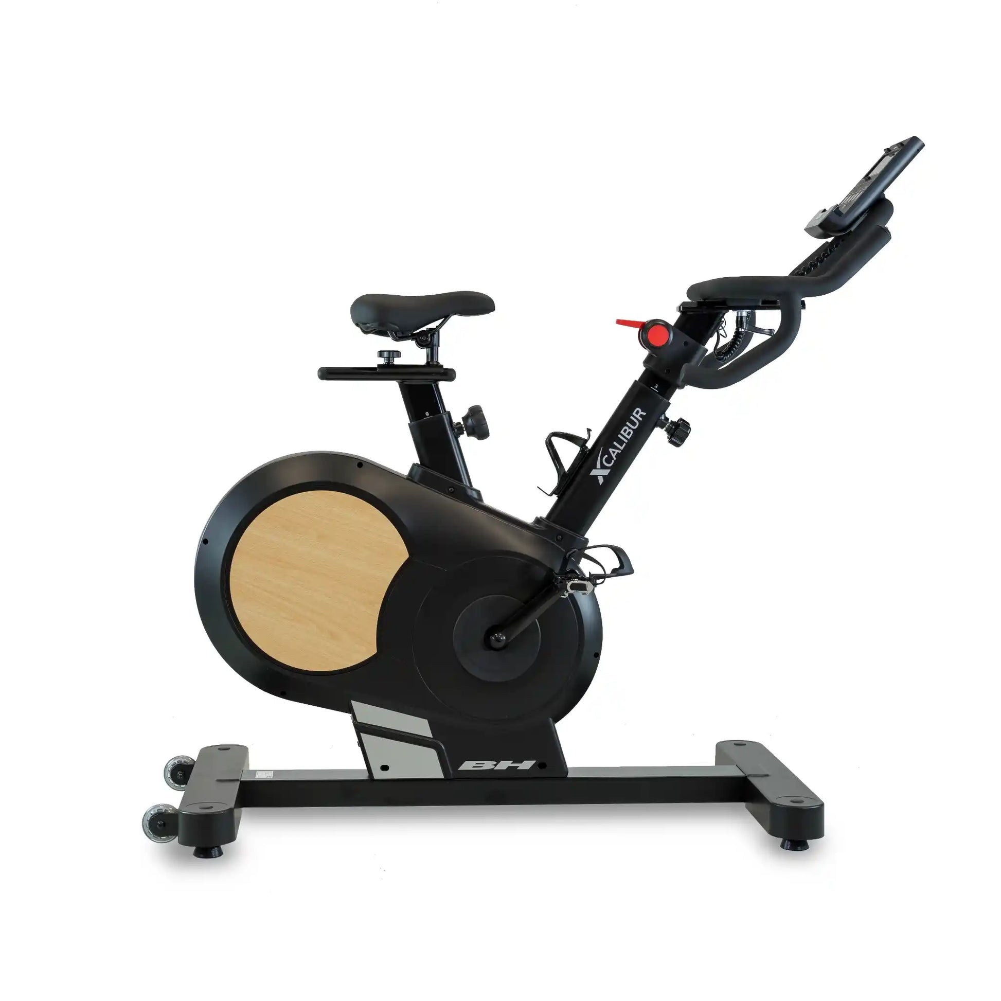 Black exercise bike with wooden finish on a white background
