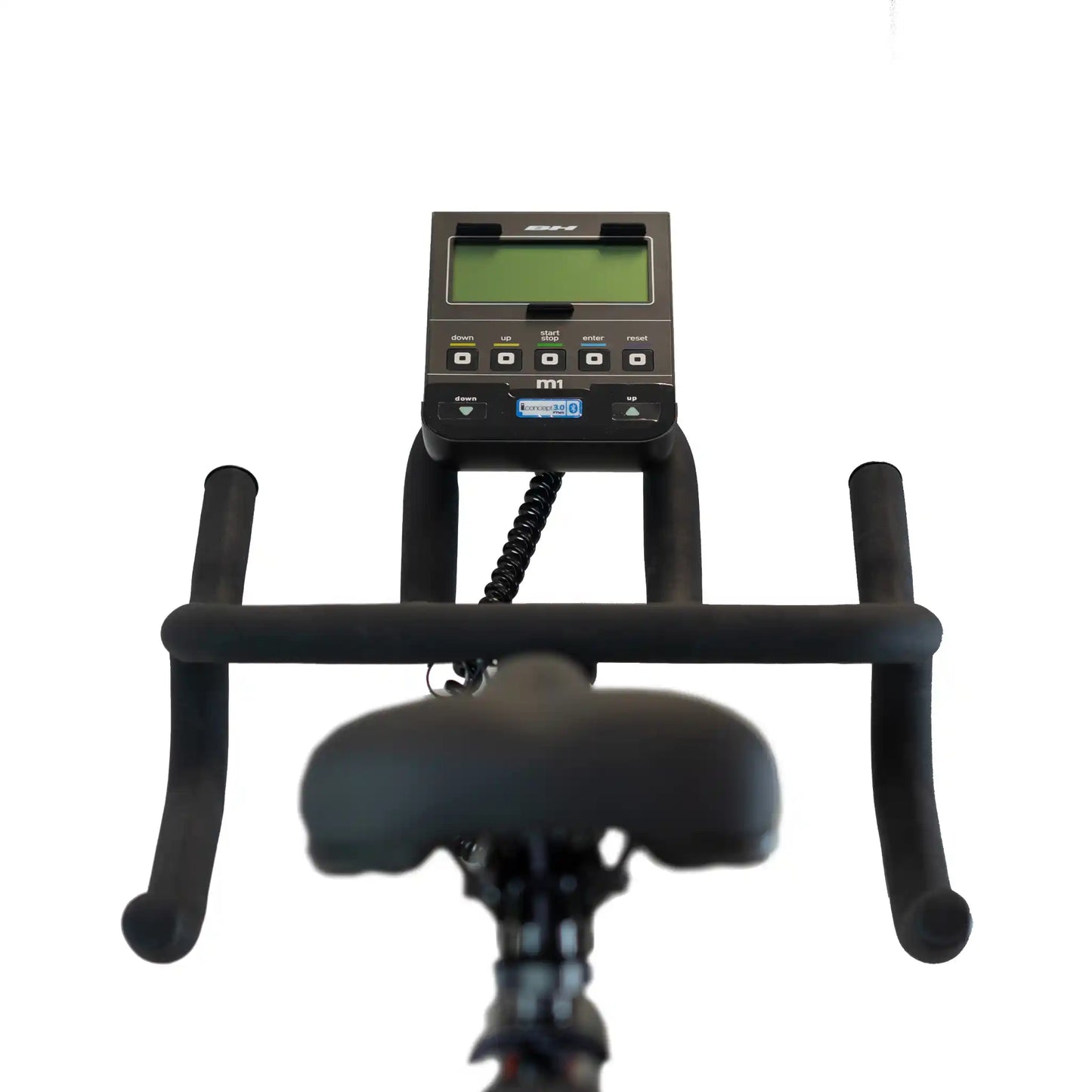 Top view of an exercise bike with digital display on a white background