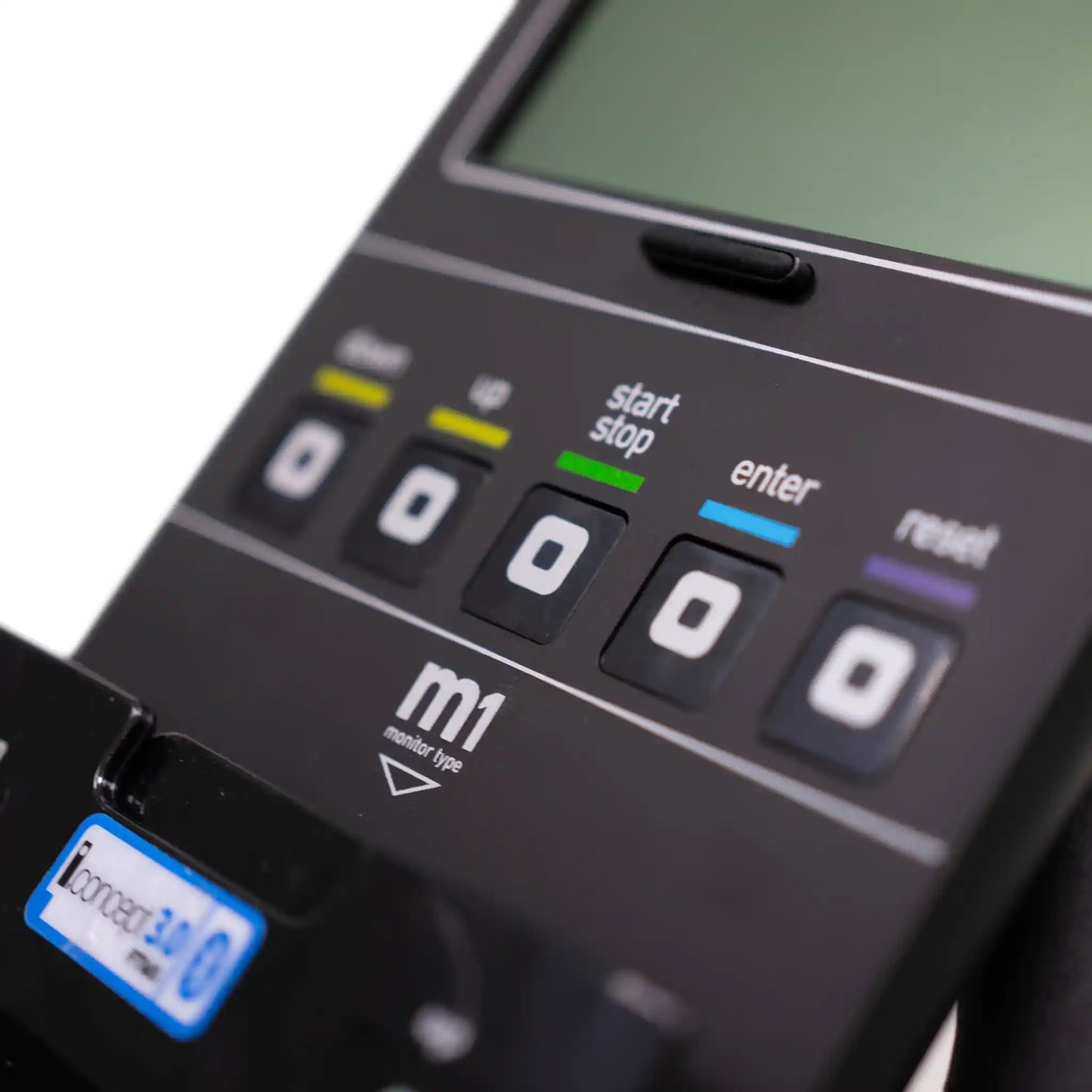 Close-up of a control panel with buttons and a screen
