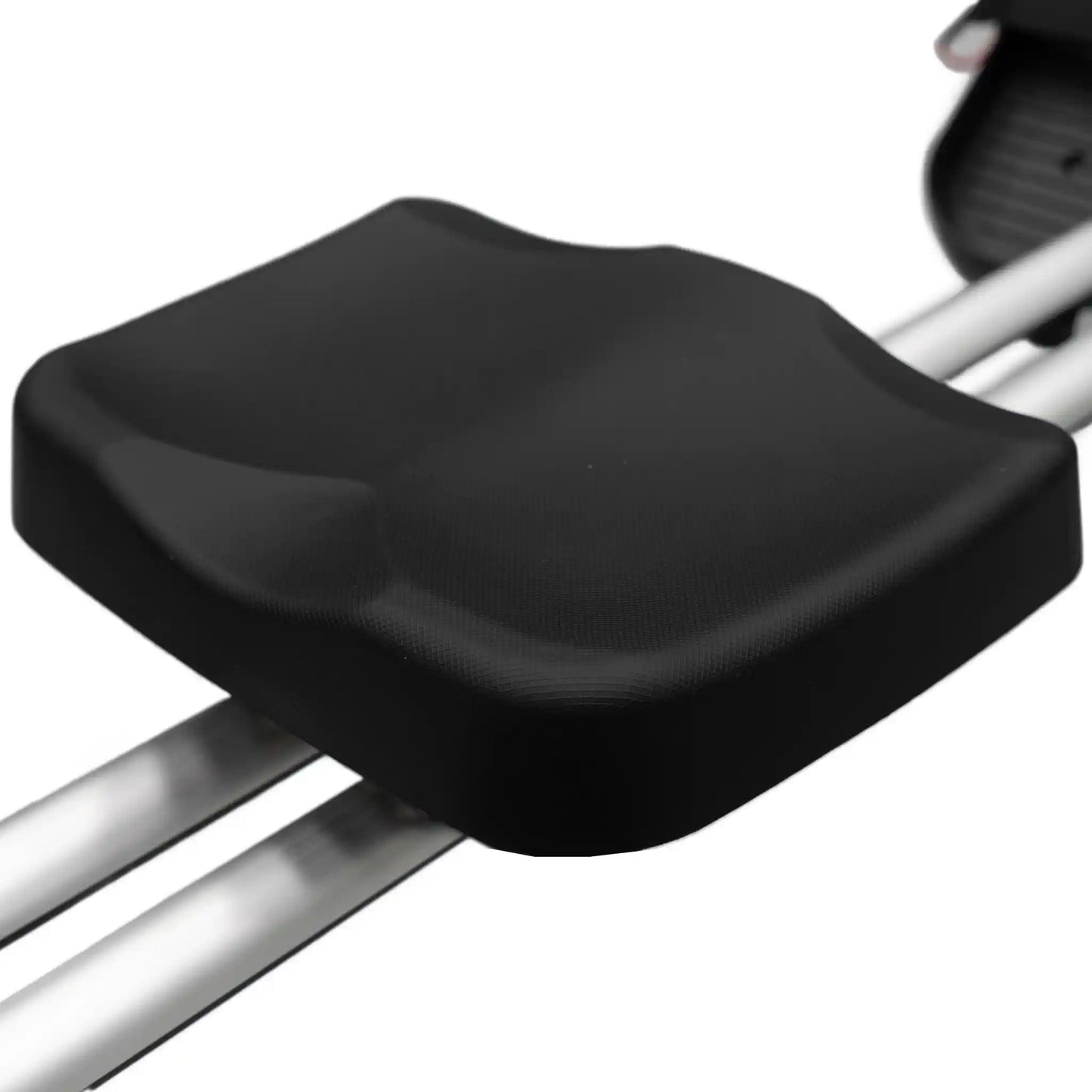 Black seat on rowing machine with a white background