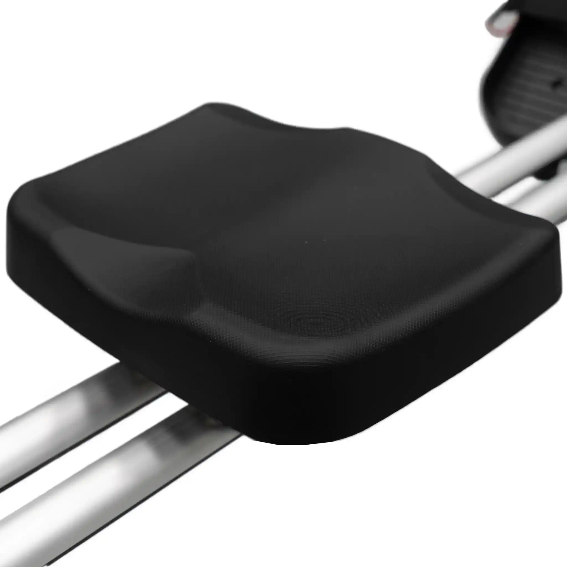 Black seat on rowing machine with a white background