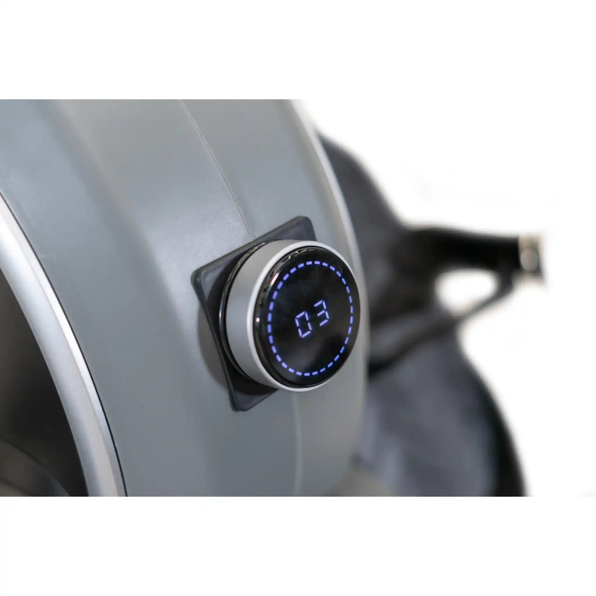Digital display on a rowing machine with a blurred background