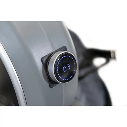 Digital display on a rowing machine with a blurred background