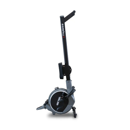 Black and grey rowing machine in an upright position on a white background