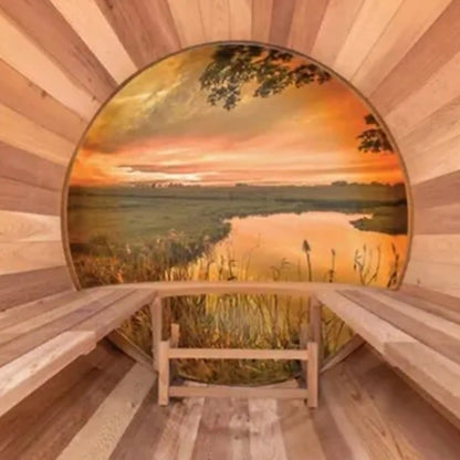 Wooden sauna with a circular window showing a sunset over water