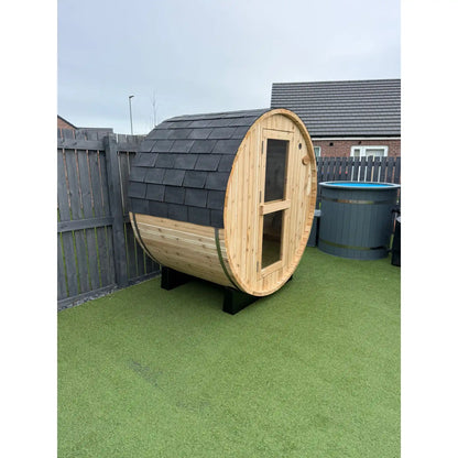 Wooden barrel sauna in garden setting