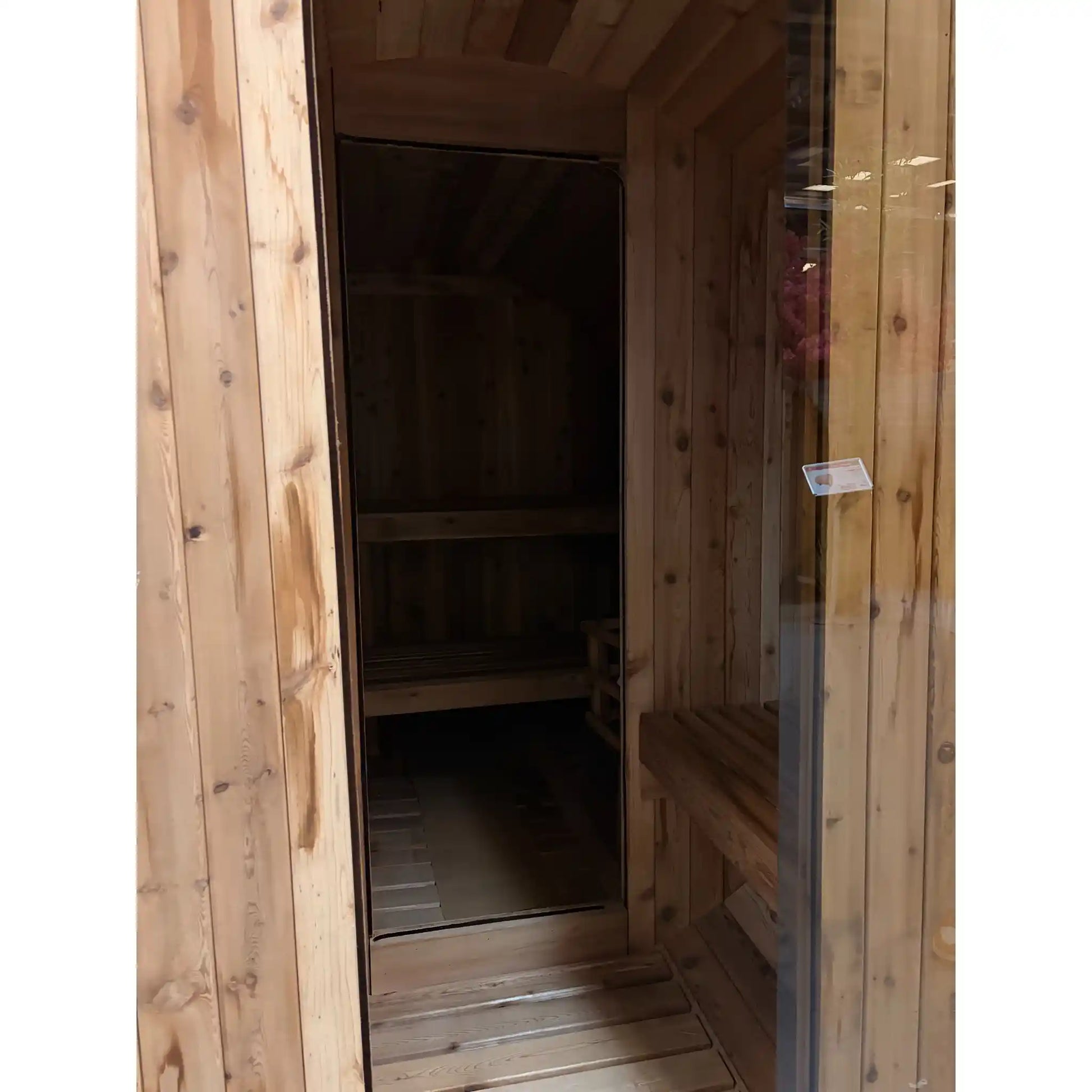 Wooden sauna with a glass door on a white background