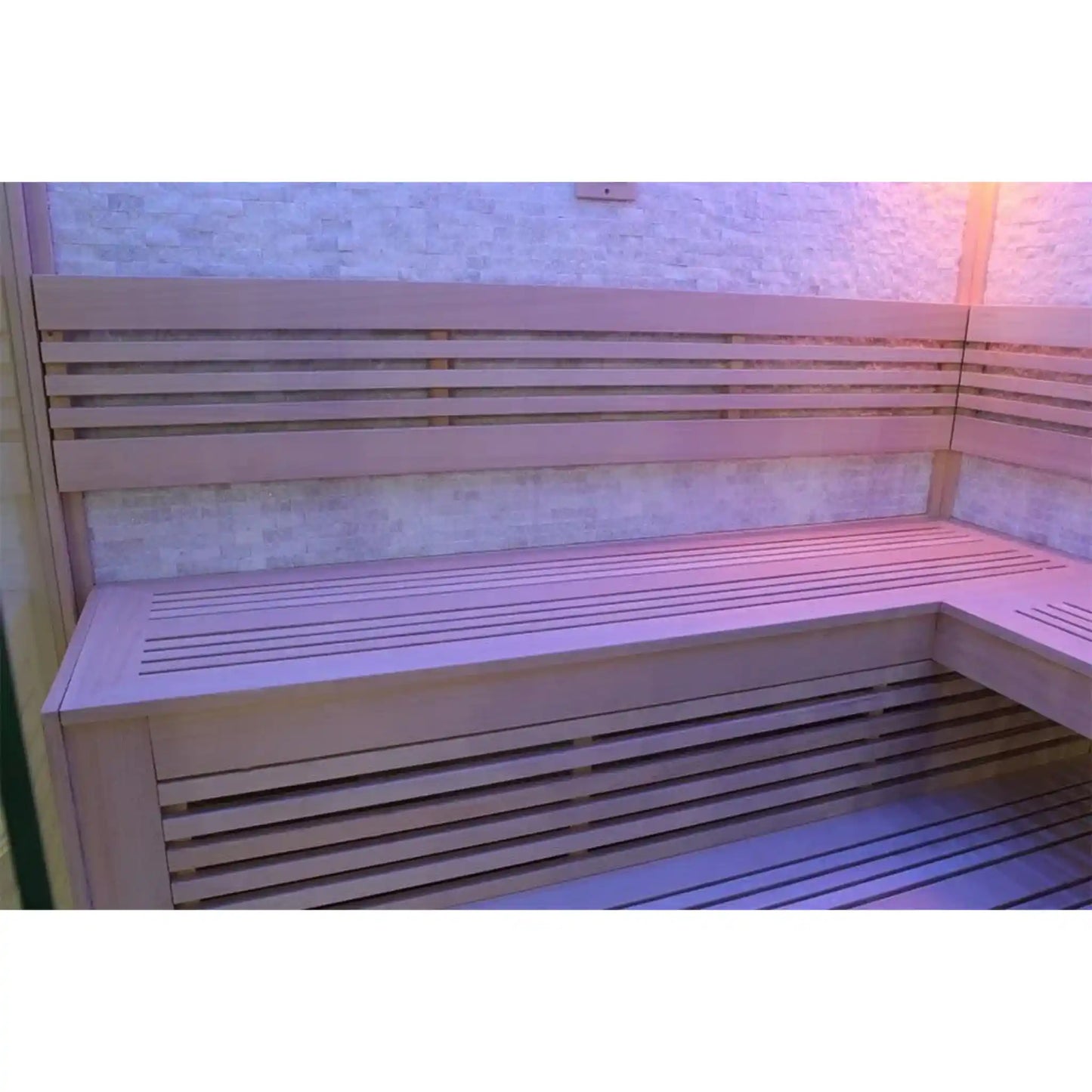 Wooden bench inside a sauna with a tiled wall in the background