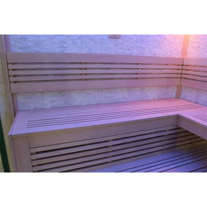 Wooden bench inside a sauna with a tiled wall in the background