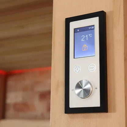 Digital temperature control panel on a sauna wall