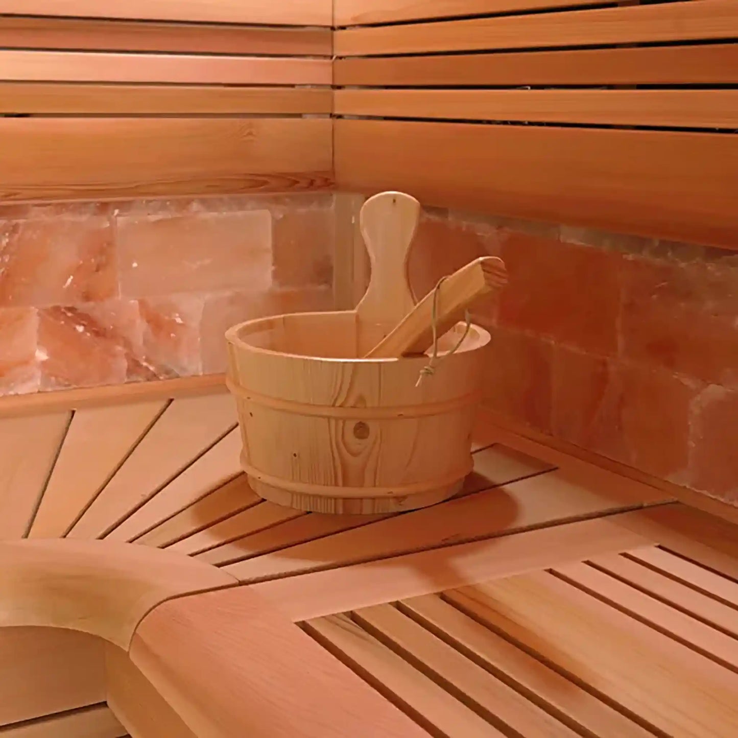 Wooden bucket with a ladle inside a wooden sauna