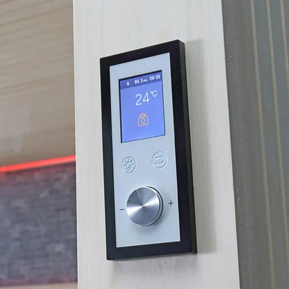 Digital thermostat on a wall of Sauna