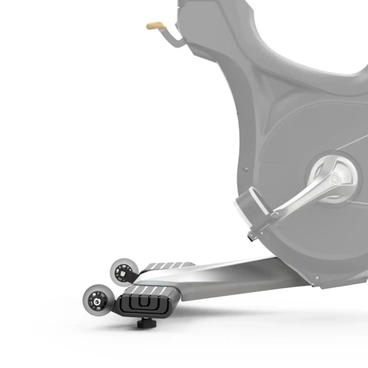 Close-up of an exercise bike showing the lower frame, foot platform with black grips, rear wheel, and part of the seat against a white background.