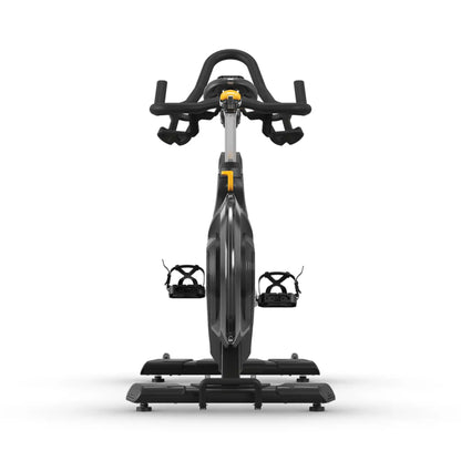 A stationary exercise bike with a black frame, black handlebars, and black pedals, featuring small yellow accents on the console and frame, shown against a solid white background.