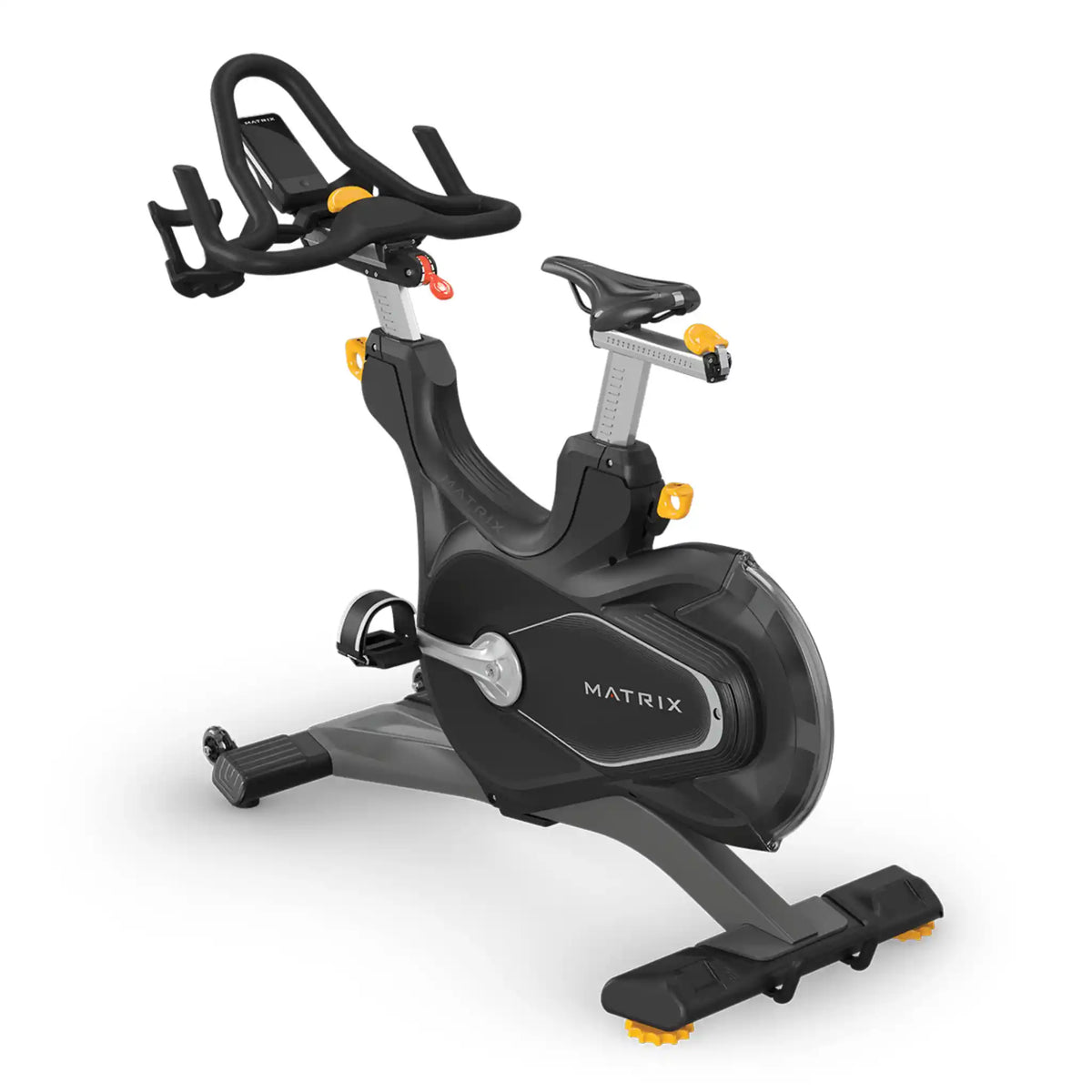 A Matrix brand indoor cycling machine in black and gray with small orange/yellow accents, shown on a clean white background.