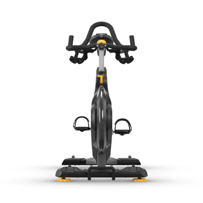 A stationary exercise bike with a black frame, black handlebars, and black pedals, accented with small yellow details on the console and feetpegs, shown against a plain white background.