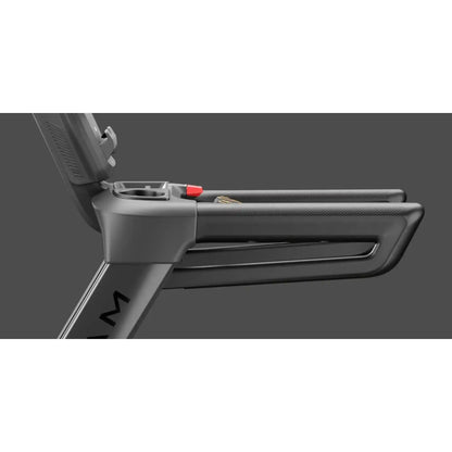 Close-up of a treadmill with a focus on the handle and control panel.