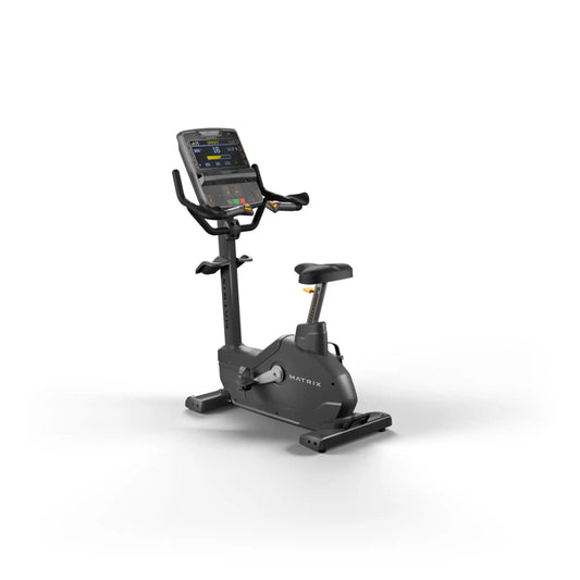 Black exercise bike with digital display on a white background