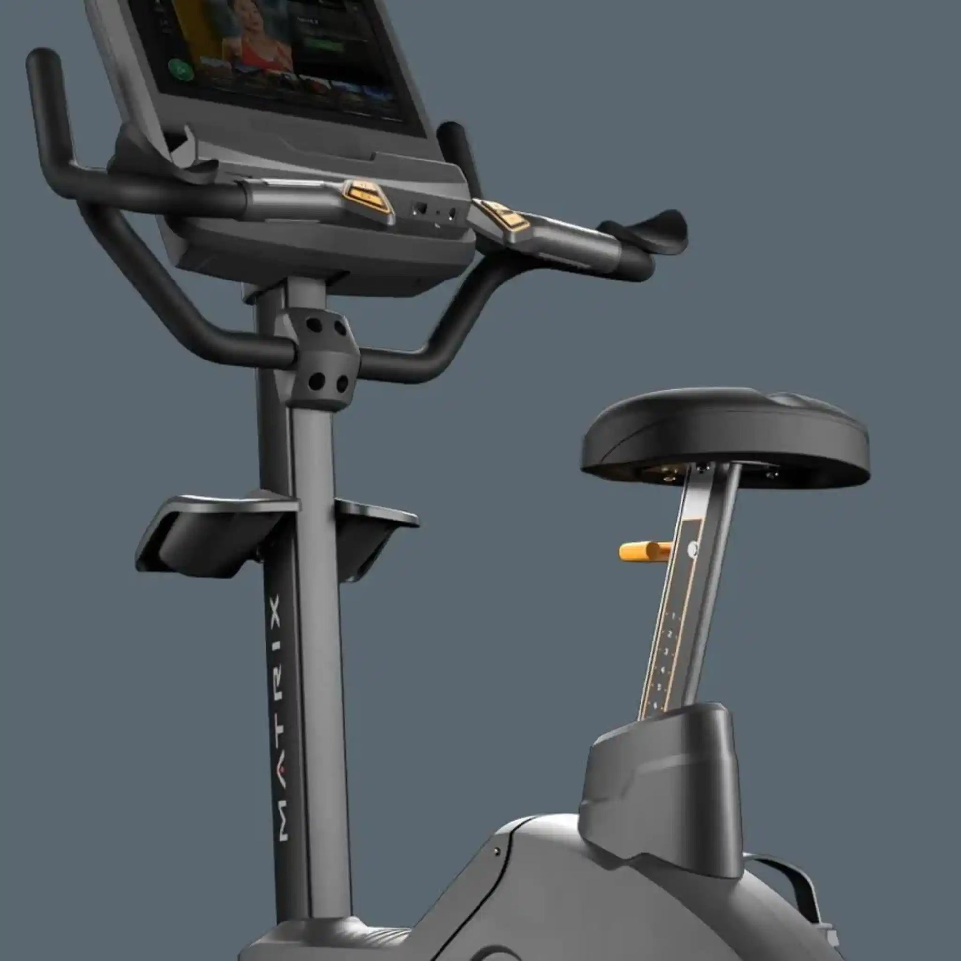 Exercise bike with digital display on a gray background