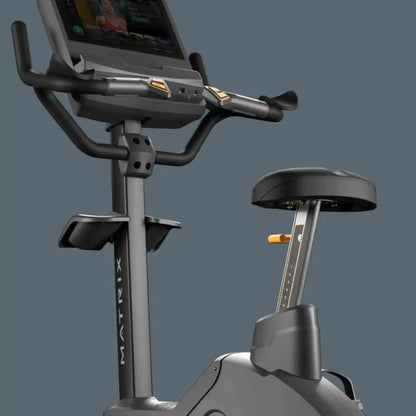 Exercise bike with digital display on a gray background