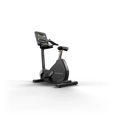 Black exercise bike with digital display on a white background