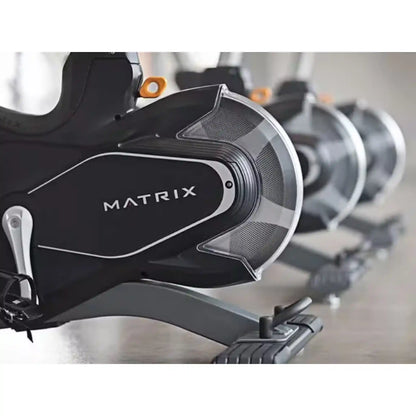 Close up of fly wheel on Matrix exercise bike