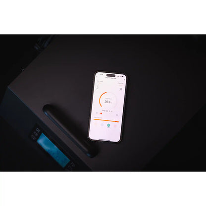 Smartphone displaying temperature reading within an app