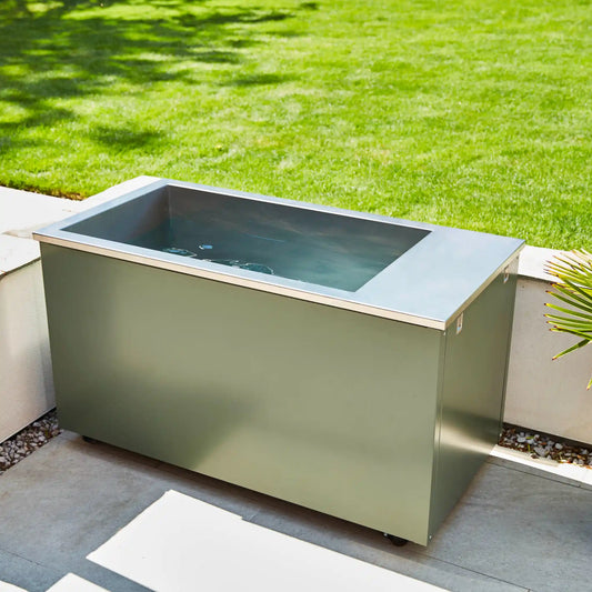 Outdoor ice bath on a patio with grass in the background