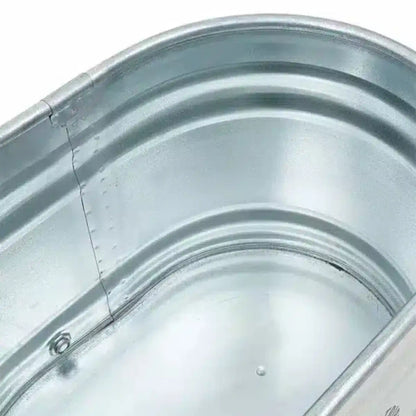 Inside of a steel ice bath on a white background